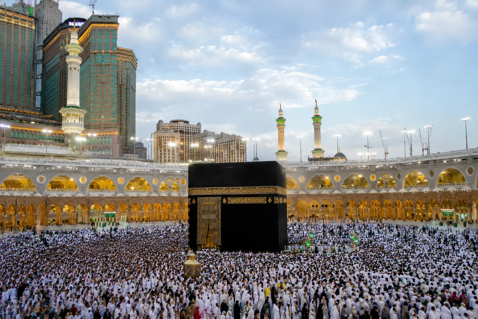 Kaaba at Masjid al-Haram in Makkah with thousands of pilgrims performing Tawaf during Umrah and Hajj.